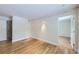 Bright living room with light wood floors and contemporary track lighting at 3420 Tennyson St # 105, Denver, CO 80212