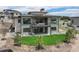 Expansive backyard with a patio, lush lawn, and privacy from surrounding trees at 6196 Oxford Peak Ln, Castle Rock, CO 80108