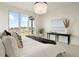 Serene bedroom with a large window offering scenic views and natural light at 6196 Oxford Peak Ln, Castle Rock, CO 80108