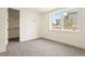 Serene bedroom featuring a closet and large window providing ample natural light and neighborhood views at 6196 Oxford Peak Ln, Castle Rock, CO 80108