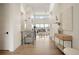 Inviting entryway features high ceilings, modern lighting, and open floor plan at 6196 Oxford Peak Ln, Castle Rock, CO 80108