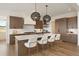 Gourmet kitchen featuring a large center island, custom cabinetry, and stainless steel appliances at 6196 Oxford Peak Ln, Castle Rock, CO 80108