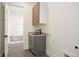 Well-designed laundry room with modern sink and ample cabinet space at 6196 Oxford Peak Ln, Castle Rock, CO 80108