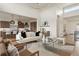 Stylish living room with open layout, modern decor, and seamless kitchen access at 6196 Oxford Peak Ln, Castle Rock, CO 80108