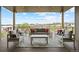 Covered patio featuring comfortable seating and a beautiful view of the horizon at 6196 Oxford Peak Ln, Castle Rock, CO 80108