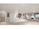 Spacious basement featuring neutral carpet, white trim, and ample storage space at 10000 E Yale Ave # 7, Denver, CO 80231