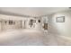 Large carpeted basement featuring white walls, trim, storage space, and a walkout at 10000 E Yale Ave # 7, Denver, CO 80231