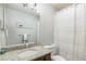 Bathroom featuring a granite vanity, a large mirror, and a shower with a striped curtain at 10000 E Yale Ave # 7, Denver, CO 80231
