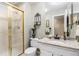 Bathroom featuring a glass shower and granite countertop sink at 10000 E Yale Ave # 7, Denver, CO 80231