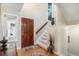 Bright entryway featuring hardwood floors and staircase at 10000 E Yale Ave # 7, Denver, CO 80231