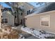 Home exterior with stone accents and landscaped garden at 10000 E Yale Ave # 7, Denver, CO 80231