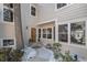 Charming front entrance with a beautiful wooden door and ample windows for natural light at 10000 E Yale Ave # 7, Denver, CO 80231