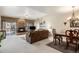 Living room with stone fireplace and dining area at 10000 E Yale Ave # 7, Denver, CO 80231