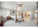 Spacious bedroom with vaulted ceilings, a ceiling fan, and a four post bed at 10000 E Yale Ave # 7, Denver, CO 80231