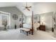 Spacious bedroom with vaulted ceilings, a ceiling fan, a large window, and a four post bed at 10000 E Yale Ave # 7, Denver, CO 80231