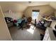 Bedroom features a window, carpeted floor, and a ceiling fan at 2874 Rose Hill St, Strasburg, CO 80136