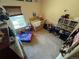 Inviting bedroom with a crib and neutral carpet, providing ample space for rest and play at 2874 Rose Hill St, Strasburg, CO 80136