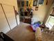 Bright bedroom with neutral carpet and wall paint, and a double door closet at 2874 Rose Hill St, Strasburg, CO 80136