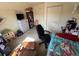 Bedroom featuring a personal work area and closet at 2874 Rose Hill St, Strasburg, CO 80136