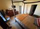 Bright main bedroom featuring a four poster bed, neutral carpet, and plenty of closet space at 2874 Rose Hill St, Strasburg, CO 80136