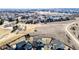 A high-angle view shows a home with a spacious yard, complemented by mature trees and surrounding neighborhood at 2954 E 108Th Dr, Northglenn, CO 80233