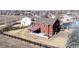 Aerial view showcasing the property's backyard, deck, hot tub, and fenced perimeter within a residential neighborhood at 2954 E 108Th Dr, Northglenn, CO 80233