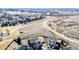 Wide aerial view showcasing the home's location, adjacent fields, and surrounding neighborhood at 2954 E 108Th Dr, Northglenn, CO 80233
