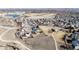 A picturesque aerial view showcases homes in a Gathering-friendly community near open fields and walking paths at 2954 E 108Th Dr, Northglenn, CO 80233