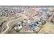 Expansive aerial view of a neighborhood featuring single-Gathering homes near a pond and open spaces at 2954 E 108Th Dr, Northglenn, CO 80233