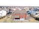 Aerial view of a home featuring a patio with a hot tub and ample backyard space in a suburban setting at 2954 E 108Th Dr, Northglenn, CO 80233