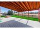 Back porch with wood beam construction and outdoor hot tub overlooking the fenced-in yard at 2954 E 108Th Dr, Northglenn, CO 80233