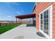 Back porch offering an outdoor living space with views of the expansive yard at 2954 E 108Th Dr, Northglenn, CO 80233
