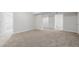 Bright basement with neutral carpeting and multiple doorways leading to other areas at 2954 E 108Th Dr, Northglenn, CO 80233