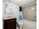 Bathroom with a vanity, tub-shower combination, and neutral tiling at 2954 E 108Th Dr, Northglenn, CO 80233