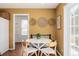 Charming breakfast nook with white table, mixed seating, and natural woven wall decorations at 2954 E 108Th Dr, Northglenn, CO 80233