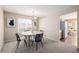 Traditional dining room with modern chandelier and backyard views at 2954 E 108Th Dr, Northglenn, CO 80233