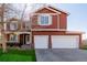 Charming two-story home with a well-maintained lawn and a spacious two car garage at 2954 E 108Th Dr, Northglenn, CO 80233
