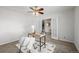 Sun-filled home office with glass doors, modern desk and ceiling fan at 2954 E 108Th Dr, Northglenn, CO 80233