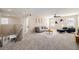 Open and airy living room with neutral decor, ceiling fan, and cozy seating area at 2954 E 108Th Dr, Northglenn, CO 80233