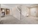 Inviting entryway with neutral tones, showcasing the staircase and seamless flow into the living room at 2954 E 108Th Dr, Northglenn, CO 80233