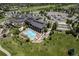 Stunning aerial view of the community clubhouse featuring a pool, parking, and green spaces at 23312 E Chestnut Pl, Aurora, CO 80016
