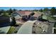 Aerial view of a home showing its driveway, landscaping, and proximity to neighboring houses at 23312 E Chestnut Pl, Aurora, CO 80016