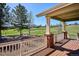 Inviting back porch with wood floors and a view of the lush green lawn at 23312 E Chestnut Pl, Aurora, CO 80016