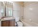 Neutral bathroom with vanity sink, toilet and tile shower and tub combo at 23312 E Chestnut Pl, Aurora, CO 80016