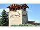 Elegant community entrance sign with stone pillars and lush landscaping, welcoming residents and visitors at 23312 E Chestnut Pl, Aurora, CO 80016