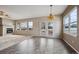 Bright dining area with tile floors, fireplace and many windows offering beautiful outdoor views and natural light at 23312 E Chestnut Pl, Aurora, CO 80016