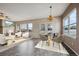 Inviting dining area with elegant furnishings, ample natural light, and fireplace views at 23312 E Chestnut Pl, Aurora, CO 80016