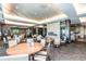 Elegant dining room featuring a fireplace, a bar, and comfortable seating at 23312 E Chestnut Pl, Aurora, CO 80016
