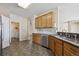 Updated kitchen featuring tiled backsplash, stainless steel appliances, and modern fixtures at 23312 E Chestnut Pl, Aurora, CO 80016