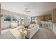 Comfortable living room with natural light, neutral tones, open layout with kitchen access at 23312 E Chestnut Pl, Aurora, CO 80016
